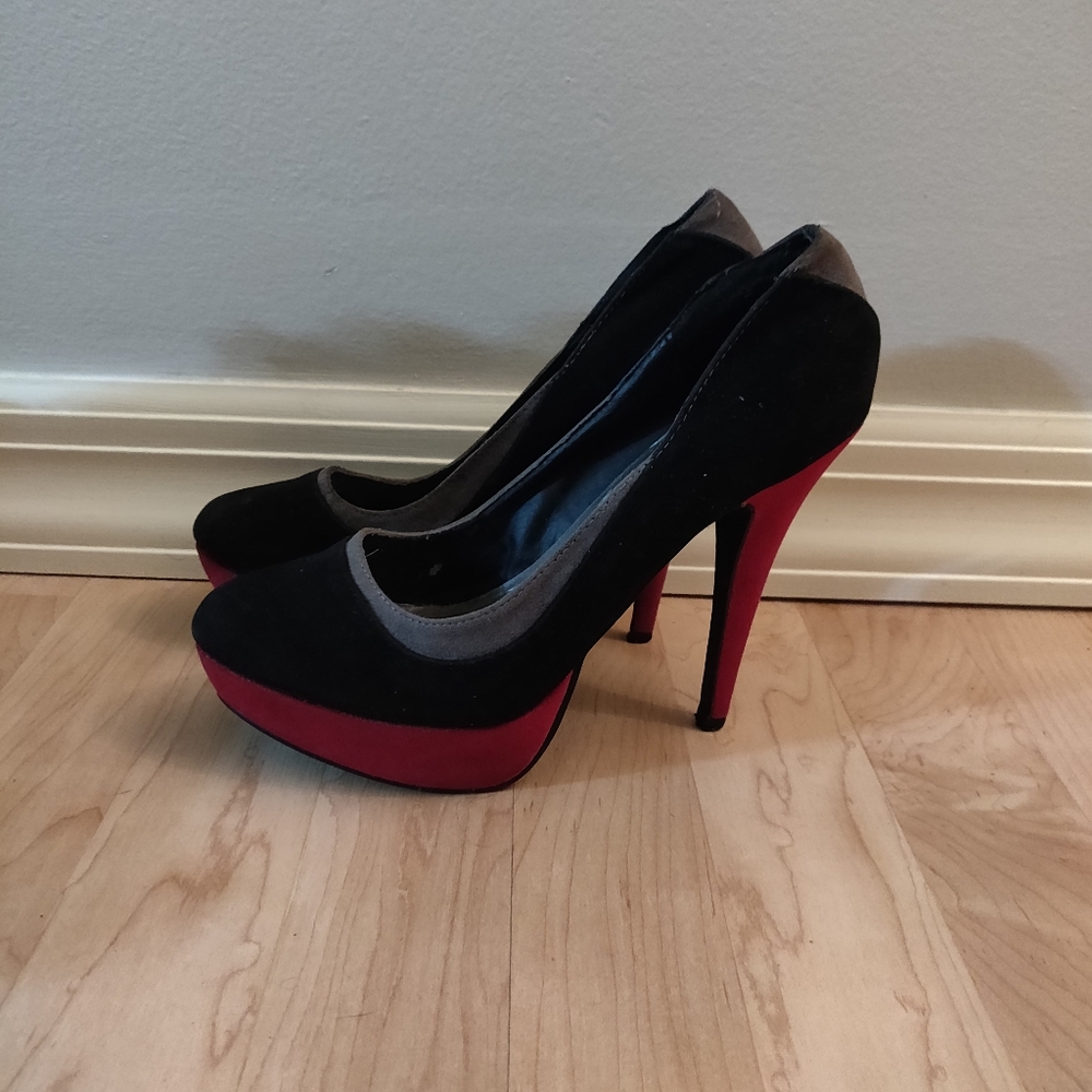 Worn red, silver and black pumps